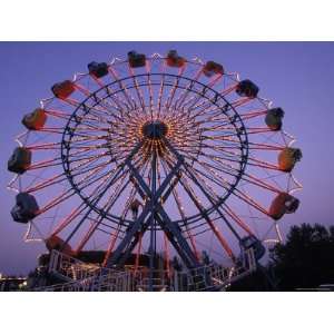 People Ride an Upsidedown Ferris Wheel in Wildwood, New Jersey Premium 