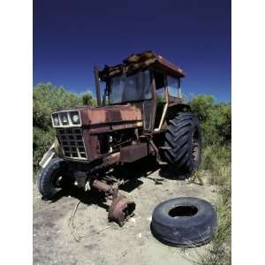  Abandoned Tractor Rusts Away Behind a Coastal Sand Dune 