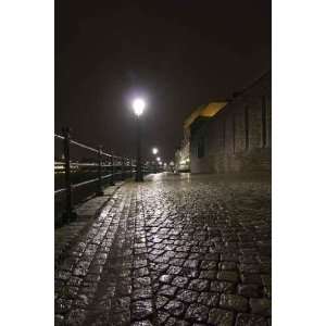 Night Shot of Wet Cobblestone Road in Maastricht 