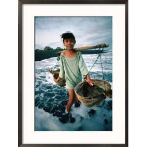  A Girl Gathers Salt Water in Lontar Leaf Buckets for Salt 