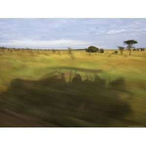  Shadow of a Moving Land ROVer Cast into Roadside Grass 