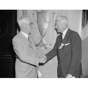   June 21. John C. Parker (left), President of the