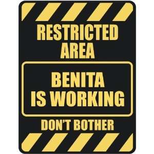   RESTRICTED AREA BENITA IS WORKING  PARKING SIGN