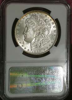 1898 o NGC UNC Detail Obverse Scratched Banded Rainbow Toned Morgan 