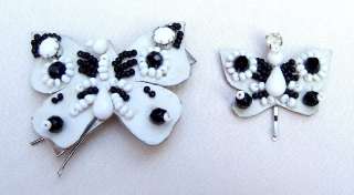 LOT OF TWO BLACK AND WHITE BUTTERFLY HAIR ORNAMENTS OR BARRETTES 