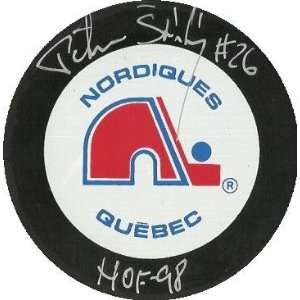   Stastny autographed Hockey Puck (Quebec Nordiques)