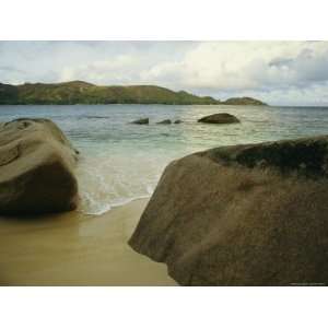  Smooth Rocks Lie on a Beach in the Seychelles Photographic 