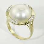   in this wonderful fashion ring the pearl s luster shows hues of purple