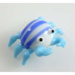 Brightly colored Crab, White body with Blue stripes & light blue legs 