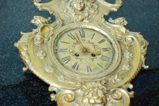 ORNATE FIGURAL EMBOSSED BRASS WAG ON THE WALL CLOCK  