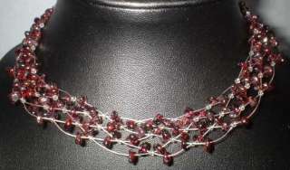 Garnet choker style necklace and matching bracelet and earrings.
