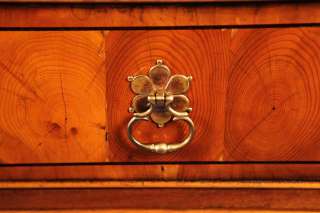 These brass pulls contrast beautifully with the yew.