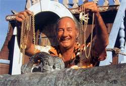 Treasure hunter Mel Fisher with gold chains found on the wreck of the 
