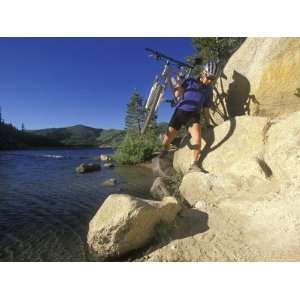  Woman Carries Her Bike to the Flume Trail at Marlette Lake 